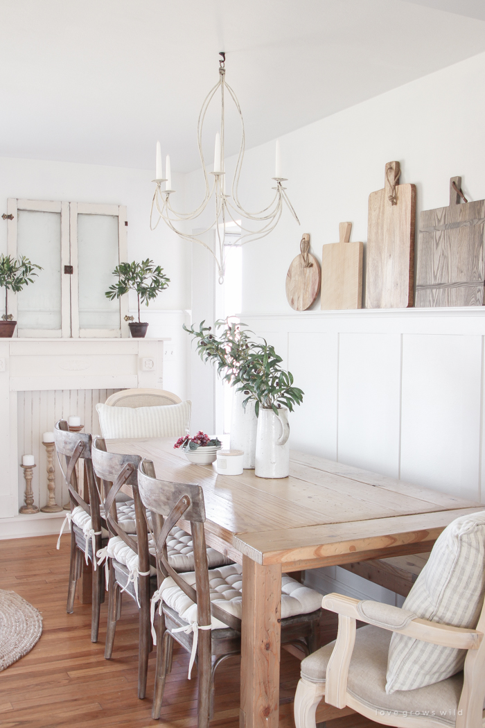 This dining room shares space with a living room, but maximizes style and looks stunningly fresh.