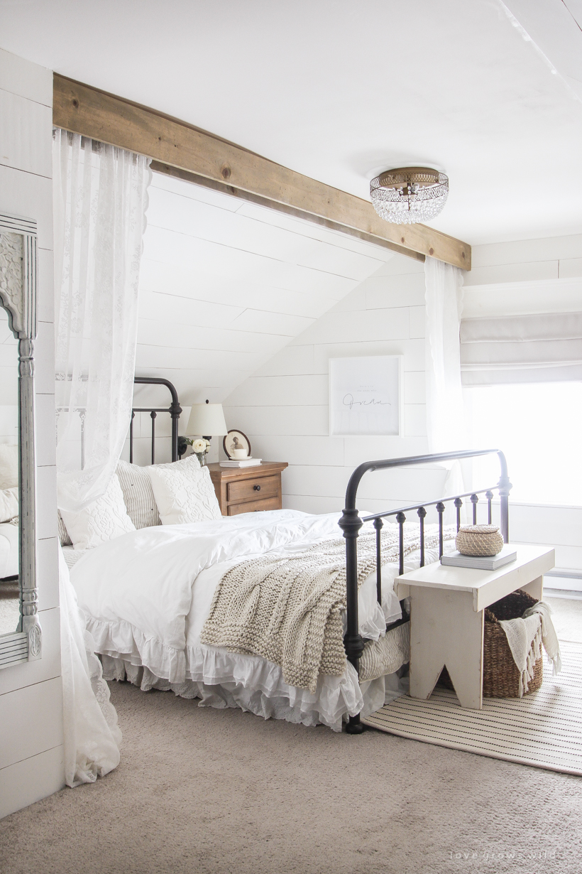 Step inside home and lifestyle blogger Liz Fourez's charming master bedroom with gorgeous farmhouse details and neutral color palette.