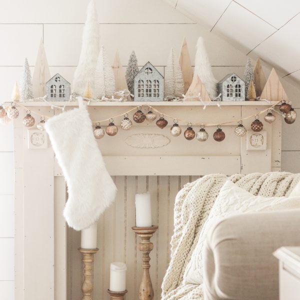 Interior decorator and home blogger Liz Fourez shares her beautiful mantel decorated for Christmas. Find out how you can build this exact mantel on LoveGrowsWild.com