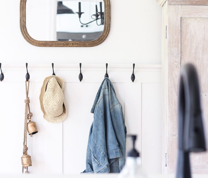 Step inside this beautiful Indiana farmhouse entryway decorated with a mix of timeworn antiques and unique DIY projects!