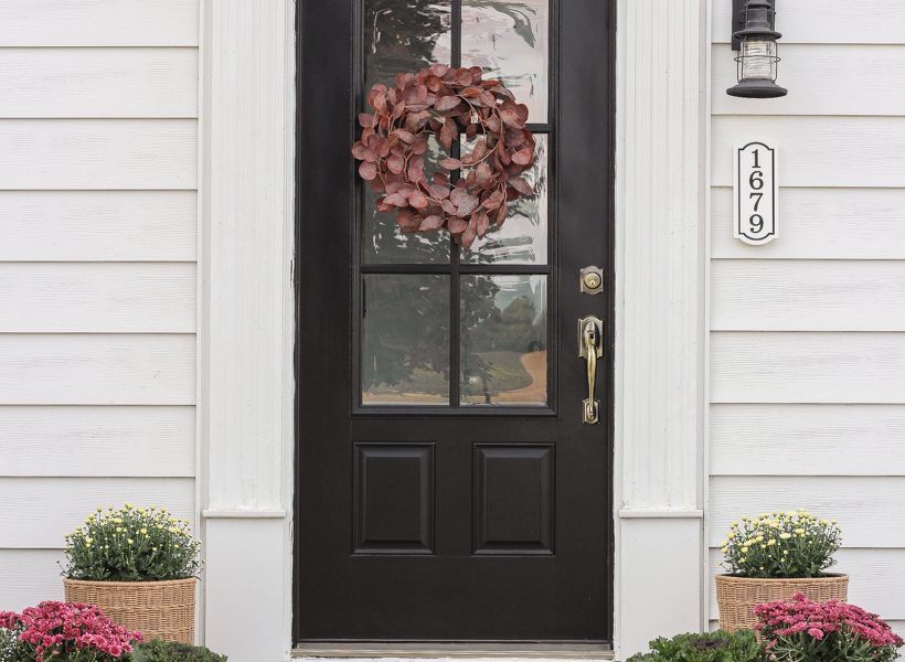 Home blogger and interior decorator Liz Fourez shares her small front porch decorated for fall with the perfect mix of soft neutrals and subtle color.