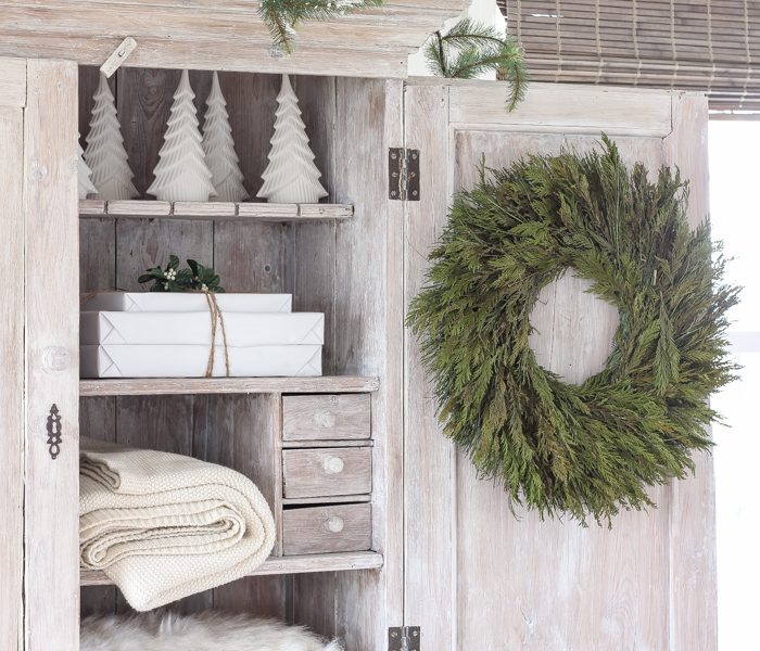 A beautiful farmhouse entryway decorated for the holidays!