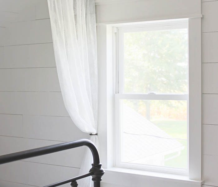 Learn how to bulk up the trim around your windows for a beautiful farmhouse look! Such an easy and inexpensive upgrade! | LoveGrowsWild.com