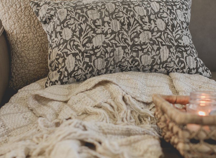 The prettiest throw pillows and blankets for fall that will instantly cozy up your home - curated by home blogger and interior decorator Liz Fourez