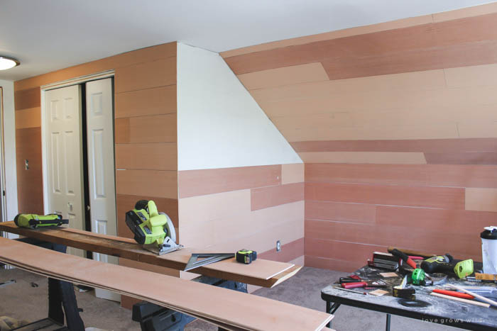 This master bedroom gets a dramatic makeover with beautiful white wide plank walls. Learn how to plank YOUR walls at LoveGrowsWild.com!