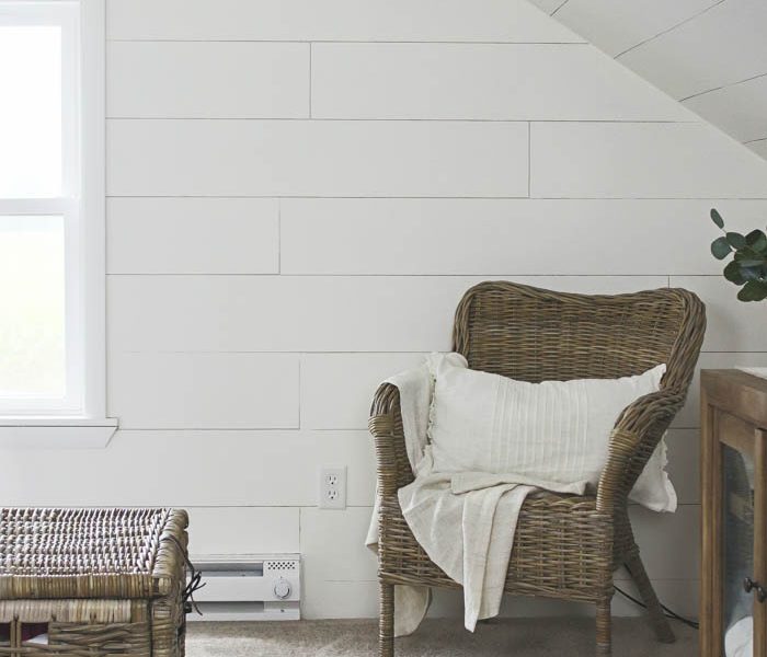 This master bedroom gets a dramatic makeover with beautiful white wide plank walls. Learn how to plank YOUR walls at LoveGrowsWild.com!