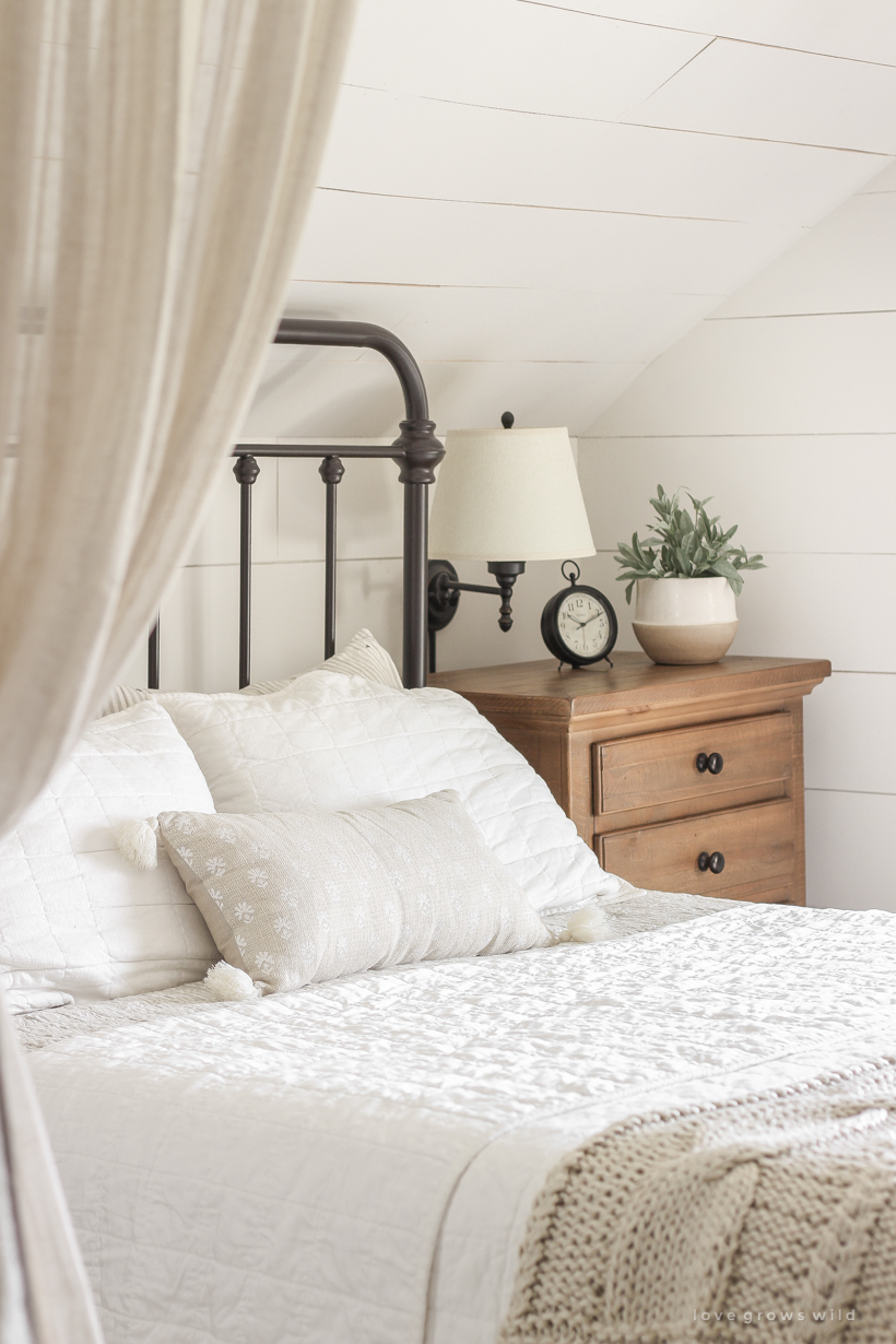 A new rug, curtains, bedding and artwork in designer Liz Fourez's beautifully cozy master bedroom