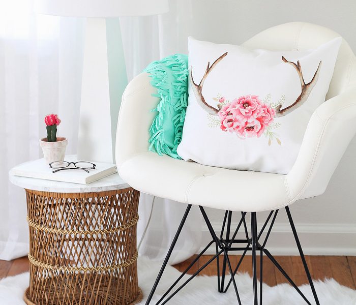 A comfy chair, faux fur rug, cute pillows, and a lamp - all you need for a cozy reading nook! See more photos of my office makeover at LoveGrowsWild.com