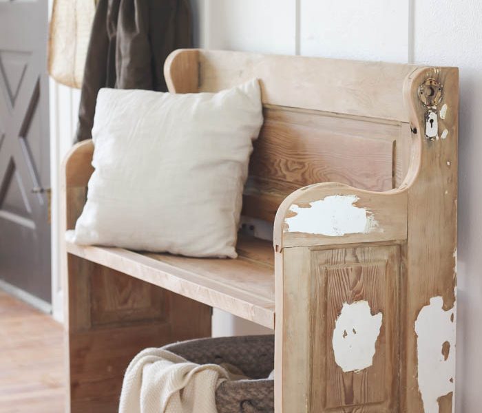 See how an old wood door transforms into a gorgeous, rustic bench! Get the full tutorial on LoveGrowsWild.com