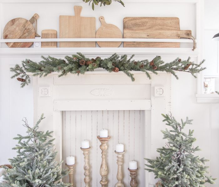 A rustic mantel is given a big makeover for the holidays! See how milk paint transformed this cozy cottage mantel.