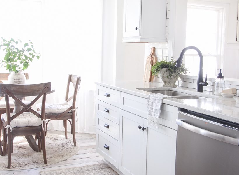 A cozy farmhouse kitchen decorated simply with elements from nature