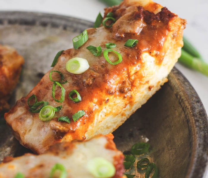 This Toasted Chili Cheese Bread is the perfect quick appetizer and SO delicious! Tons of gooey cheese with a spicy kick of chili! Recipe at LoveGrowsWild.com