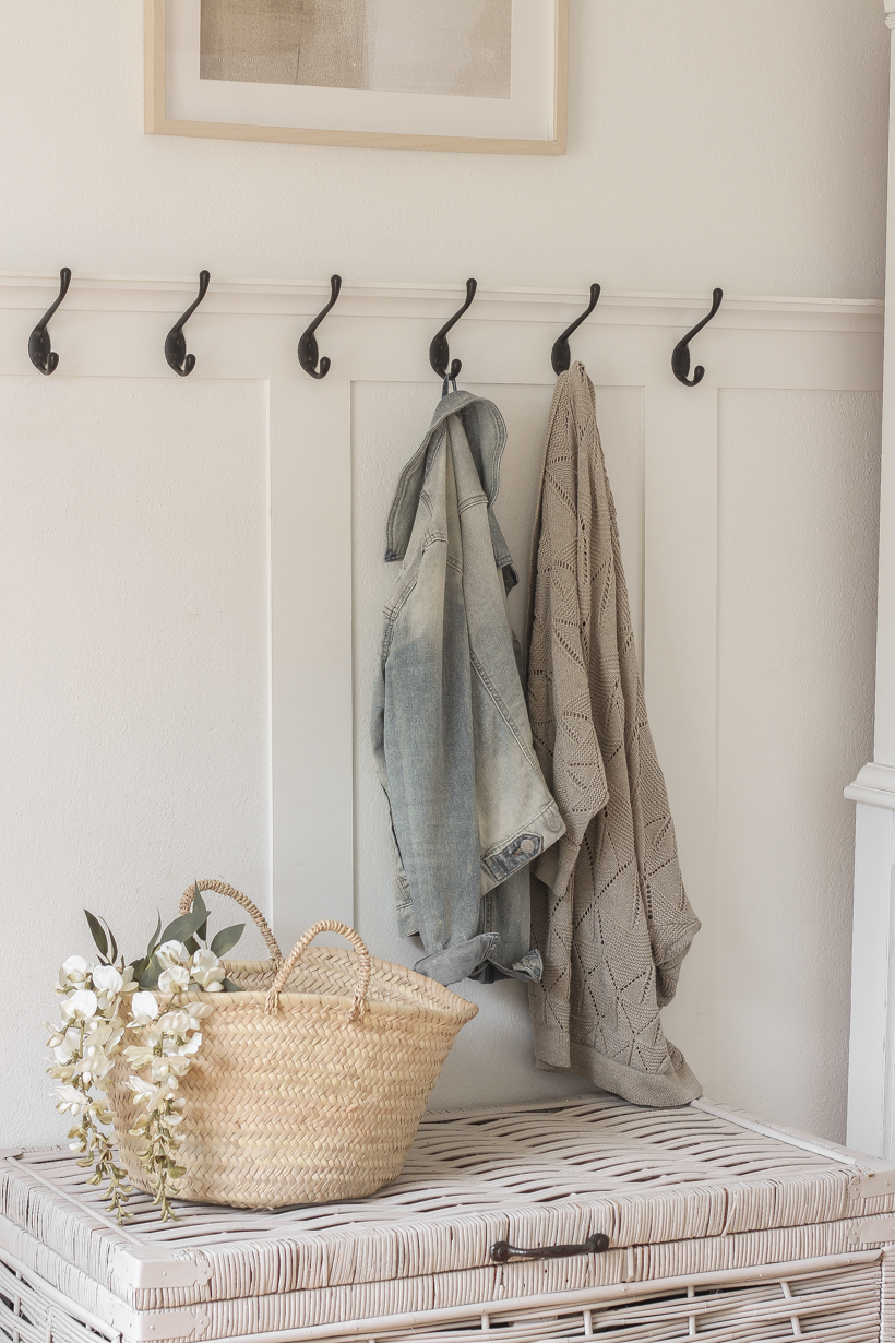 A beautiful neutral entryway shared by home blogger and interior decorator Liz Fourez