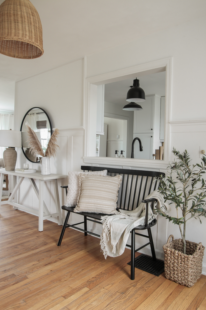 A beautiful neutral entryway shared by home blogger and interior decorator Liz Fourez