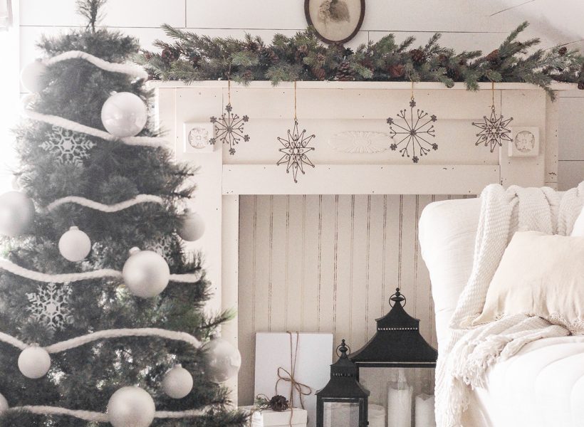 A simple, cozy bedroom decorated for Christmas with a "vintage winter wonderland" theme