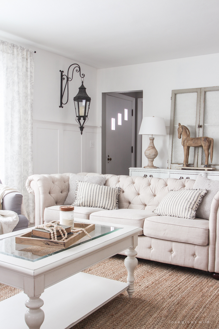 A beautiful farmhouse living room that feels cozy, bright, and totally charming!